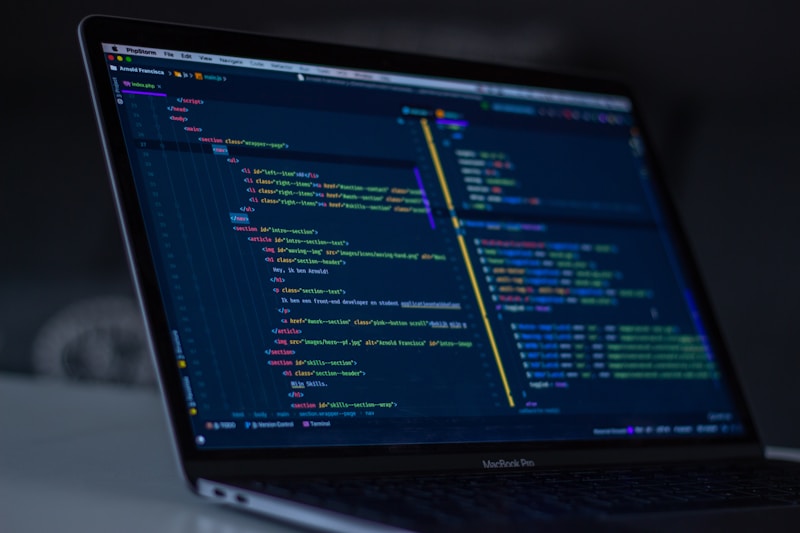 Hacker typing malicious code — phishing attack tactics